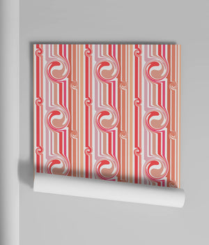 Popsicle wallpaper by Liberty James Studio in pink and coral, wavy popsicle stripes on a bedroom wall