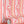 Popsicle wallpaper by Liberty James Studio in pink and coral, wavy popsicle stripes in a bathroom setting