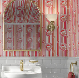 Popsicle wallpaper by Liberty James Studio in pink and coral, sample roll showing wavy popsicle stripes