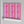 Popsicle wallpaper by Liberty James Studio in pink, wavy popsicle stripes on a bathroom wall