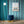 Popsicle wallpaper by Liberty James Studio in teal, sample roll showing wavy popsicle stripes