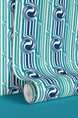 Popsicle wallpaper by Liberty James Studio in teal, wavy popsicle stripes behind a sofa in a living room