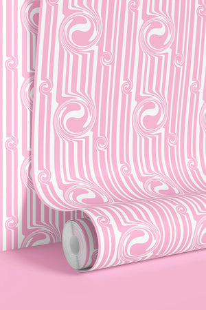 Popsicle wallpaper by Liberty James Studio in pink, partly unrolled roll showing wavy popsicle stripes