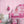 Popsicle wallpaper by Liberty James Studio in pink, wavy popsicle stripes behind a bed