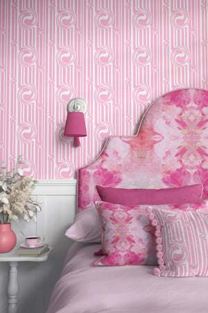 Popsicle wallpaper by Liberty James Studio in pink, wavy popsicle stripes behind a bed