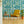 Climbing Vine wallpaper by Annika Reed in teal and yellow, climbing vines in a living room