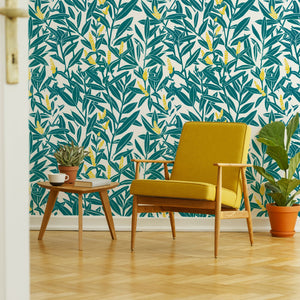 Climbing Vine wallpaper by Annika Reed in teal and yellow, climbing vines in a living room