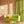 Psychedelic Pop Wallpaper wallpaper by Liberty James Studio in orange, a psychedelic mirrored design on a living room wall
