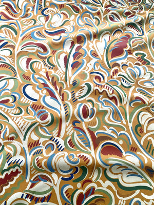 Raphaelle linen by Claire de Quénetain in brown, draped, showing a hand-painted floral design