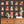 Resisting Arrest wallpaper by Brand McKenzie in black, animal mugshot portraits above a sideboard