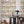 Roar Emotions wallpaper by Brand McKenzie in multicolour, pop-art tiger faces in a dining room