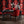 Ruby Elixir wallpaper by Liberty James Studio in black and red, mirrored art deco motifs in a dining area