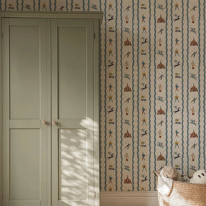 Run Away to the Circus wallpaper by Annika Reed in green, circus performers and tents behind a bed