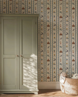 Run Away to the Circus wallpaper by Annika Reed in green, circus performers and tents behind a bed