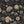 Seasons in Bloom wallpaper by Victoria Sanders in charcoal, flat sample of a meadow of flowers rising from the base