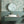 Seaview wallpaper by XV Interiors in green, fish among seaweed in a bathroom setting