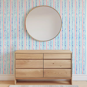 Sail Ahoy wallpaper by Seed Home Designs in blue, fine nautical stripes above a sideboard