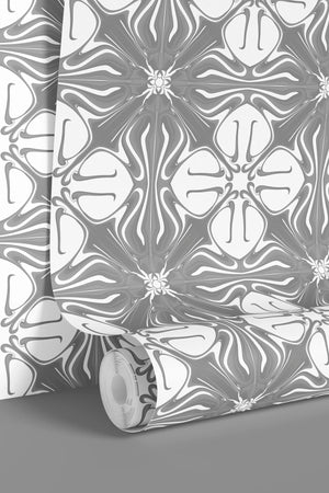 Santorini Tile wallpaper by Liberty James Studio in grey and white, a Mediterranean tile pattern behind a bed