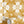 Santorini Tile wallpaper by Liberty James Studio in ochre and white, a Mediterranean tile pattern on a feature wall