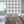 Santorini Tile wallpaper by Liberty James Studio in grey and white, roll showing a Mediterranean tile pattern