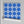 Santorini Tile wallpaper by Liberty James Studio in blue, partly unrolled roll showing (alternate view)