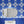Santorini Tile wallpaper by Liberty James Studio in blue and white, a Mediterranean tile pattern on a bathroom wall