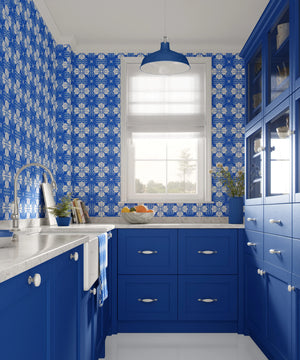Santorini Tile wallpaper by Liberty James Studio in blue, a Mediterranean tile pattern behind bar stools