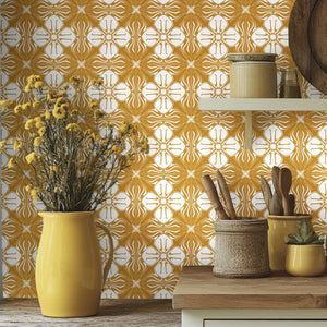 Santorini Tile wallpaper by Liberty James Studio in ochre, a Mediterranean tile pattern above a sideboard