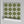 Santorini Tile wallpaper by Liberty James Studio in olive, sample roll showing a Mediterranean tile pattern