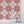 Santorini Tile wallpaper by Liberty James Studio in pink and white, a Mediterranean tile pattern above a cabinet