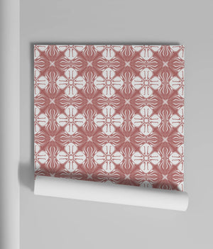 Santorini Tile wallpaper by Liberty James Studio in pink, partly unrolled roll showing a Mediterranean tile pattern