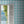 Santorini Tile wallpaper by Liberty James Studio in blue, a Mediterranean tile pattern in a styled room setting