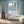 Santorini Tile wallpaper by Liberty James Studio in blue, a Mediterranean tile pattern in a living room