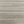 Savannah Plain wallpaper by The Monkey Puzzle Tree in beige, flat sample of a textured grass effect