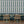 Scallop Lane wallpaper by Liberty James Studio in slate blue and cream, scalloped stripes in a dining area