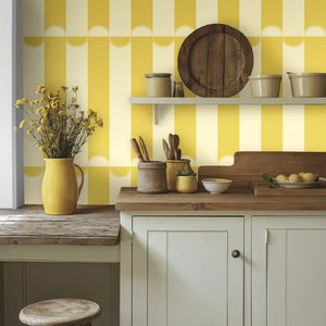 Scallop Lane wallpaper by Liberty James Studio in yellow and cream, scalloped stripes in a bathroom