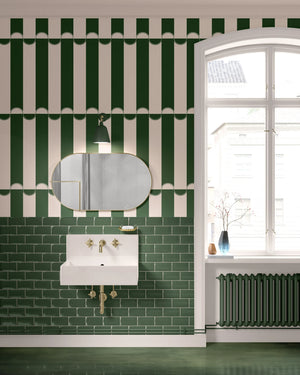 Scallop Lane wallpaper by Liberty James Studio in green, scalloped stripes in a bathroom