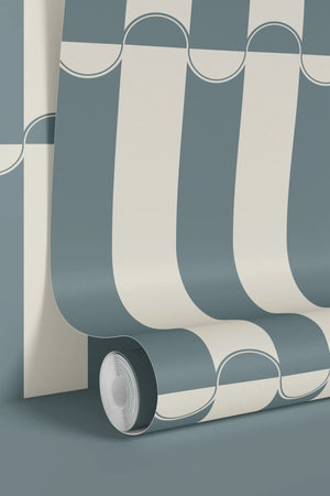 Scallop Lane wallpaper by Liberty James Studio in slate blue and cream, roll showing scalloped stripes