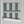 Scallop Lane wallpaper by Liberty James Studio in slate blue and cream, sample roll showing scalloped stripes