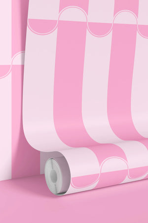 Scallop Lane wallpaper by Liberty James Studio in pink, sample roll showing scalloped stripes