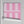 Scallop Lane wallpaper by Liberty James Studio in pink, partly unrolled roll showing scalloped stripes