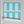 Scallop Lane wallpaper by Liberty James Studio in turquoise and white, roll showing scalloped stripes