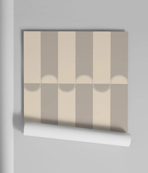 Scallop Lane wallpaper by Liberty James Studio in grey, partly unrolled roll showing scalloped stripes
