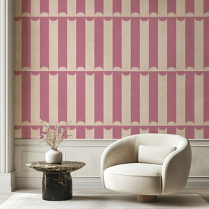 Scallop Lane wallpaper by Liberty James Studio in pink, scalloped stripes in a living room