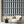 Scallop Lane wallpaper by Liberty James Studio in navy, scalloped stripes in a living room