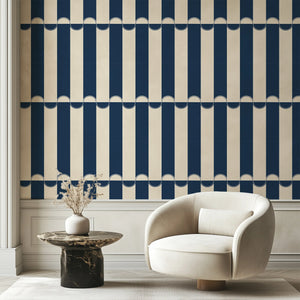 Scallop Lane wallpaper by Liberty James Studio in navy, scalloped stripes in a living room