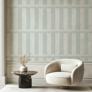 Scallop Lane wallpaper by Liberty James Studio in pale blue and white, scalloped stripes in a bathroom setting