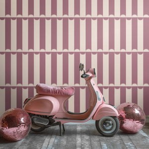 Scallop Lane wallpaper by Liberty James Studio in pink, scalloped stripes in a styled room setting