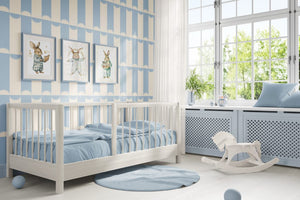 Scallop Lane wallpaper by Liberty James Studio in blue, scalloped stripes in a living room