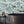 Sea Life wallpaper by Brand McKenzie in orange, fish and sea creatures in a bathroom